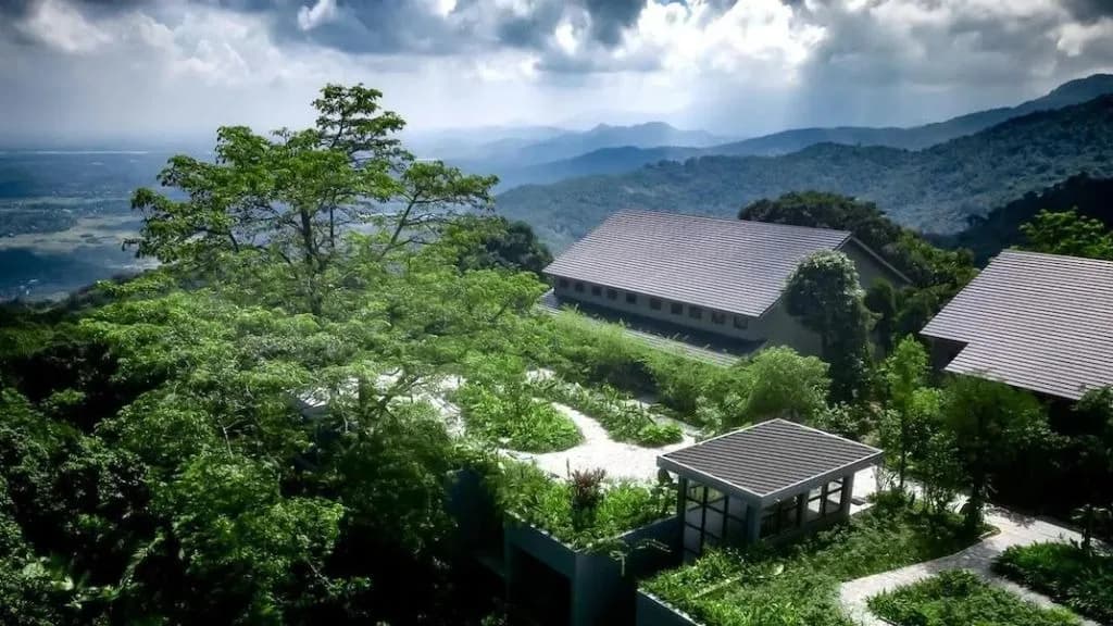 Amour Resort Ba Vi aerial view, nestled in lush greenery.