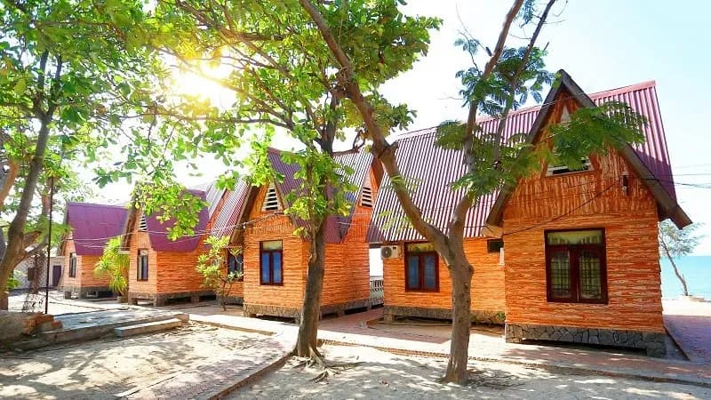 Wooden cabins by Ca Na Beach provide a cozy and comfortable retreat.