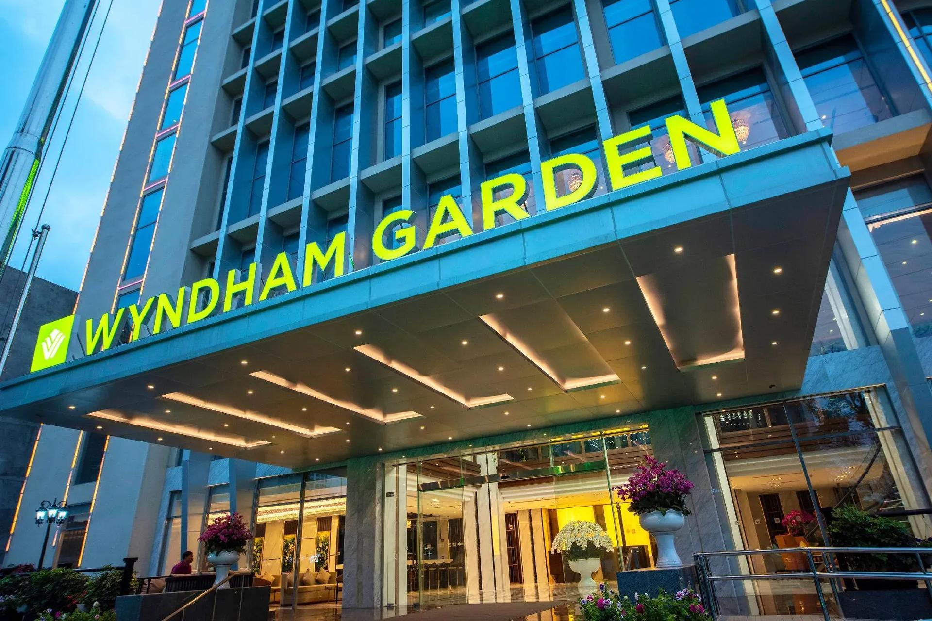 The modern entrance of Wyndham Garden Hanoi with brilliant lighting.