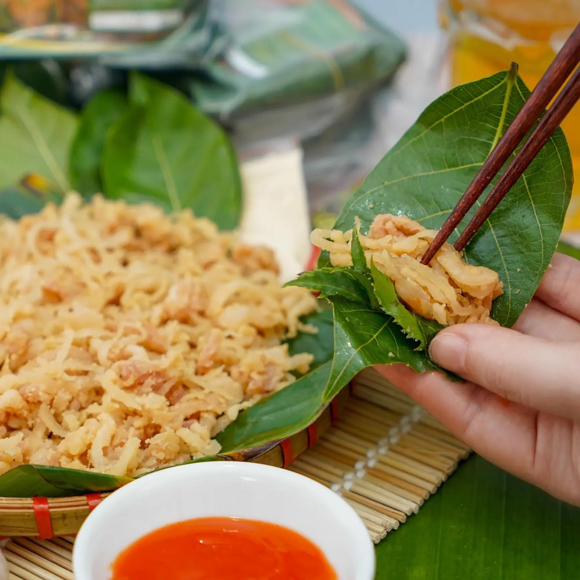 Savoring Nem Bùi with fig leaves