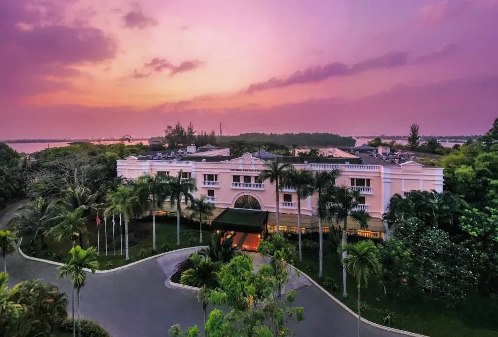 A panoramic view of Victoria Can Tho under the romantic sunset sky by the Hau River.