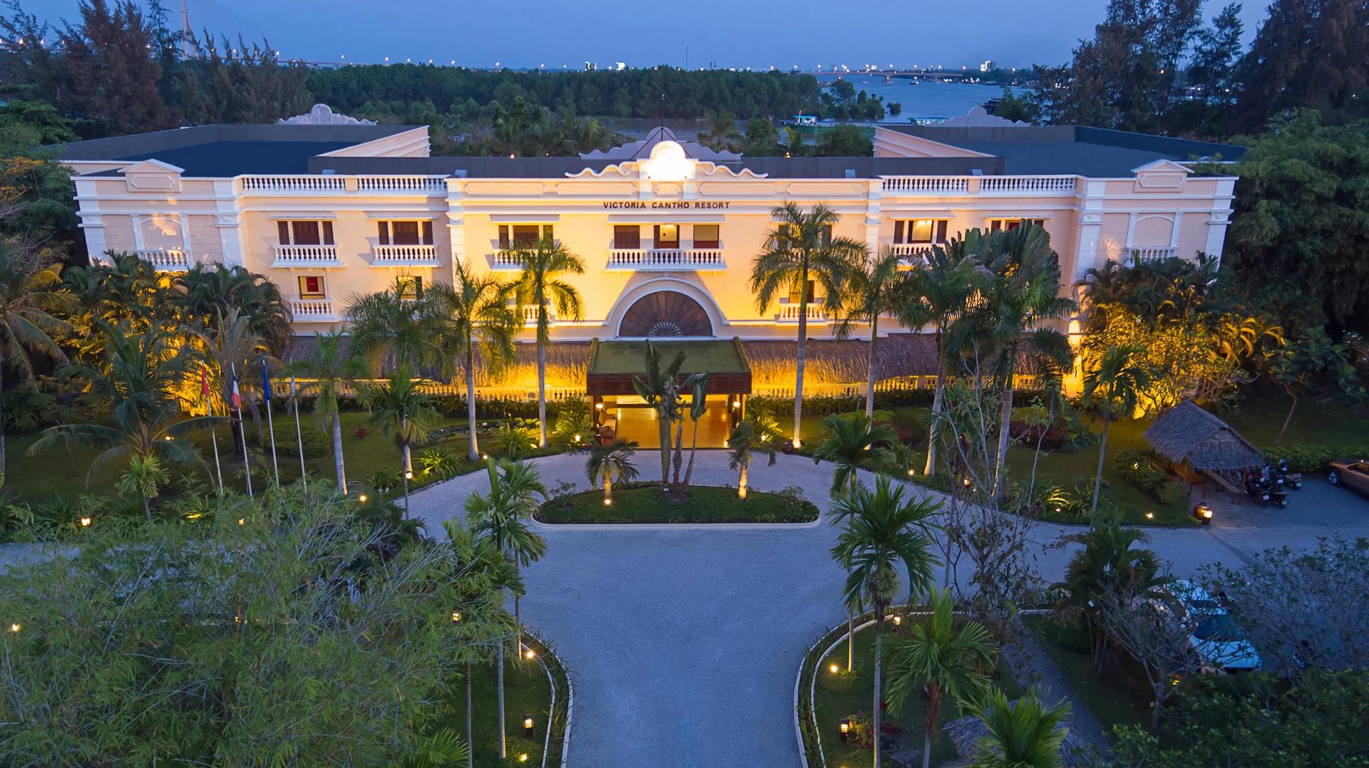 The Victoria Can Tho Resort at sunset showcases stunning Indochine architecture.