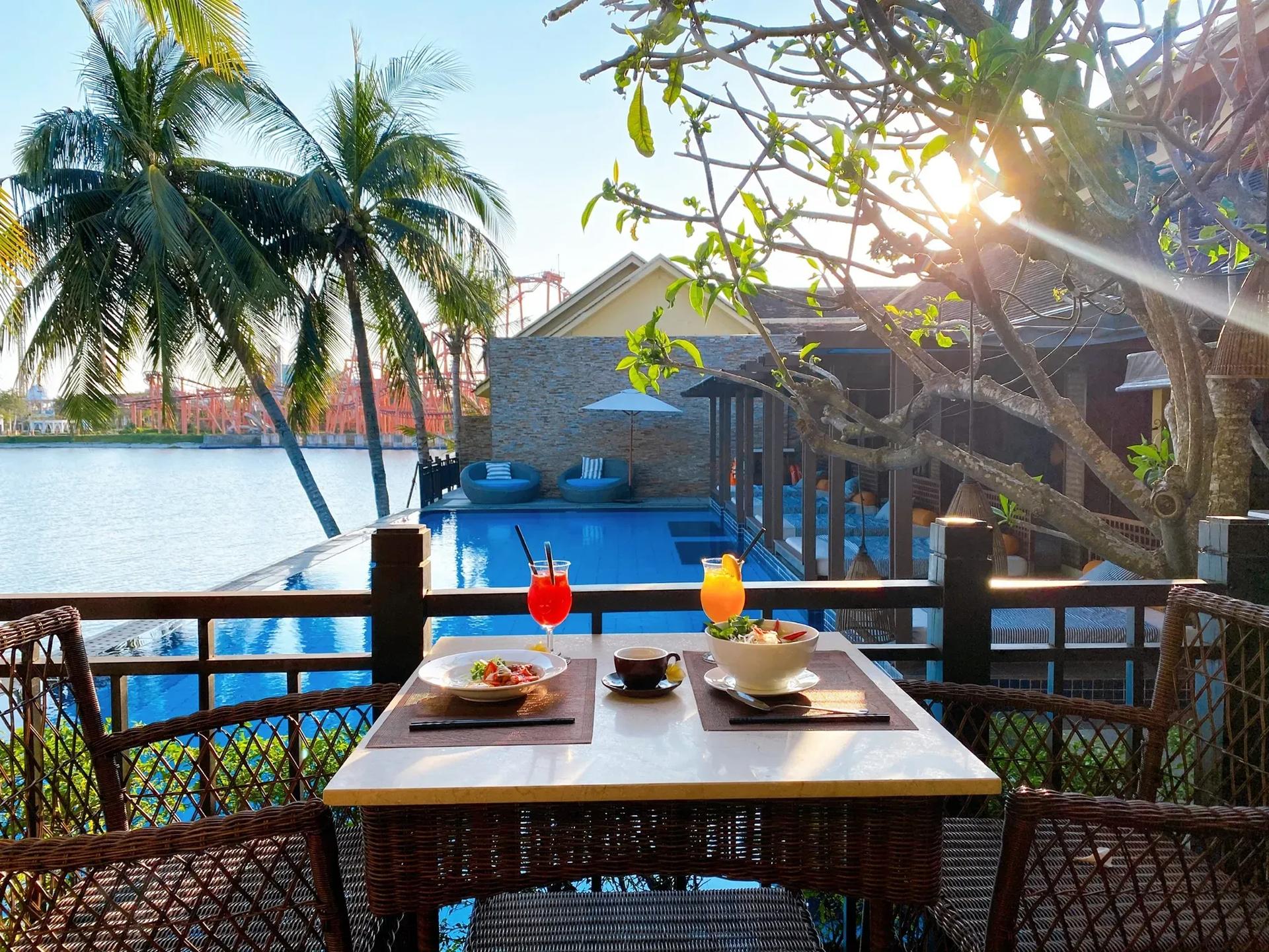 Poolside breakfast with fruit cocktail and gentle sunlight.