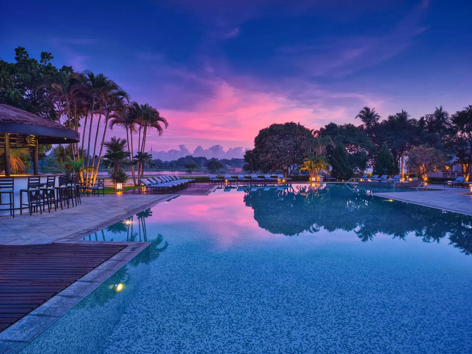 pool at sunset with a beautiful sunset sky